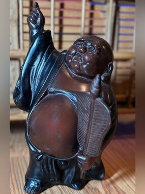 Takaoka bronze statue depicts Hotei (Laughing Buddha)Japan's Seven Lucky Gods,